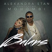 Stan and Mohombi staying close to each other in front of a grey background, with the song's title, 