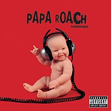 A baby wearing headphones on a red background.