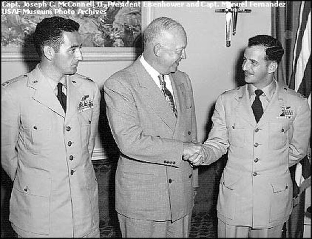 Air Force aces Joseph McConnell and Manuel "Pete" Fernandez meet with President Dwight D. Eisenhower at the White House in May 1953.