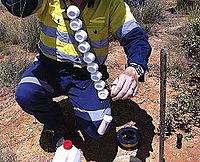 DGT devices being deployed into groundwater in the Tanami Desert, Australia. DGT deployed borehole.jpg