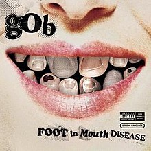 the cover contains an image of a person's mouth smiling with toes for teeth. Above, the word "GOB" appears, and below that, "Foot in Mouth Disease" is written below, the words "F" and "M" in cooper black font. Also there are greasy black marks noticeable.