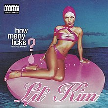 An image of a woman wearing a pink swimsuit and swimming cap while sitting on a pink circle. The names of the single and the artist are superimposed over the image.