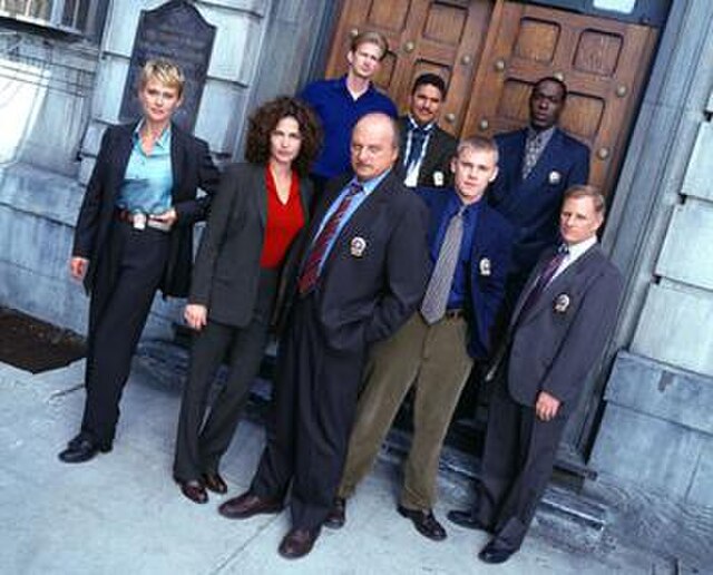 Main cast at the beginning of season seven of NYPD Blue, l-r Thompson, Delaney, Brochtrup, Franz, Turturro, Schroder, McDaniel, Clapp