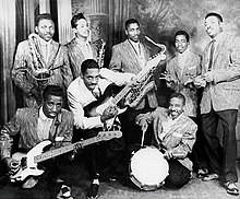 Ike Turner's Kings of Rhythm (1956). Back: Jackie Brenston, Raymond Hill, Eddie Jones, Fred Sample, Billy Gayles. Front: Jesse Knight Jr., Ike Turner, and Eugene Washington