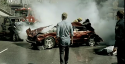 Lifehouse lead singer Jason Wade looks on the scene of a deadly car crash. Broken Music Video.png