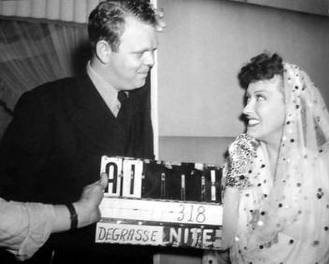 Hively with actress Gloria Swanson on the set of the 1941 film, Father Takes a Wife