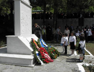 Wreath from small children to the monument of the Nazis' Holocaust in Pyrgoi