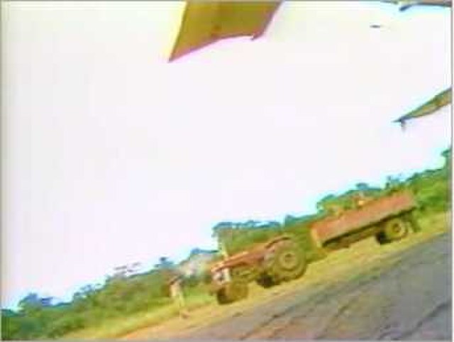 NBC footage taken by Bob Brown, showing gunmen exiting a tractor and trailer at the airstrip