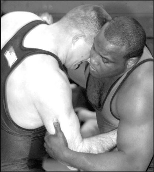 Two wrestlers in a clinch, using over- and underhooks
