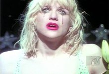 Love's character in the video is almost identical to the character portrayed on the front artwork for Live Through This. Self-image is a major theme of the album and "Miss World" especially. Miss World comparison.jpg