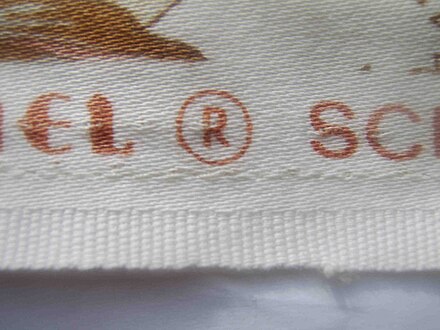 A piece of curtain fabric showing its selvedge, i.e. the self-finished edge in the foreground