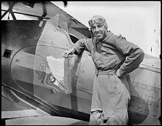 Ernest K. Warburton with his 575HP pursuit plane at East Boston Airport.jpg