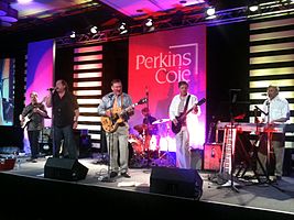 Perkins Coie Band, 2013. S lijeva udesno: Steve Harrold, Arunas Bura, Harry Schneider, Dan Cunneen, Tor Midtskog, Al Smith (nije na slici: Garth Brandenburg)