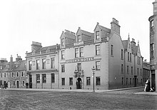 The bar of the original incarnation of the Queens Hotel, and the other buildings on the northern side of the hotel, were demolished in the 1950s to make way for the bus station Queens Hotel, Perth.jpg