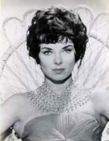 Black-and-white publicity photo of a woman with black hair looking into the camera.