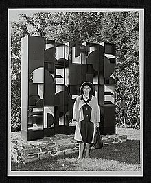 Louise Nevelson standing in front of her artwork at Pocantico Hills, 1969, Impact Photos Inc., photographer. Louise Nevelson papers, Archives of American Art, Smithsonian Institution, Washington, DC. AAA neveloui 19662.jpg