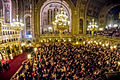 Lighting candles from the new flame of Romanian Orthodox Easter.