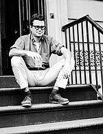 Krim sitting on a stoop in the East Village