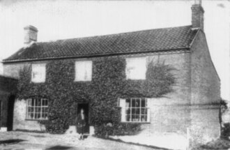 The Crown Pub in the 1920s. The pub is still open today. Colkirk Crown.jpg