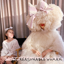 A girl on the left looks up at the woman sitting next to her, who is wearing an oversized sheep costume with a pink bow that only exposes her mouth and hands; letters are scratched out in white at the bottom and in black the album title "REASONABLE WOMAN" is handwritten in