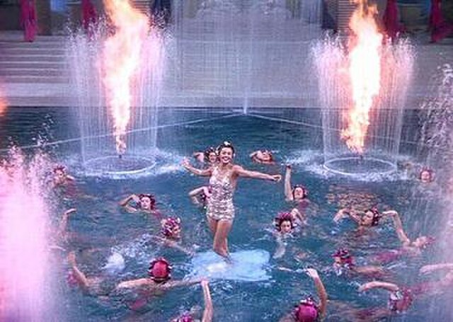 Esther Williams emerges from the water during the finale.