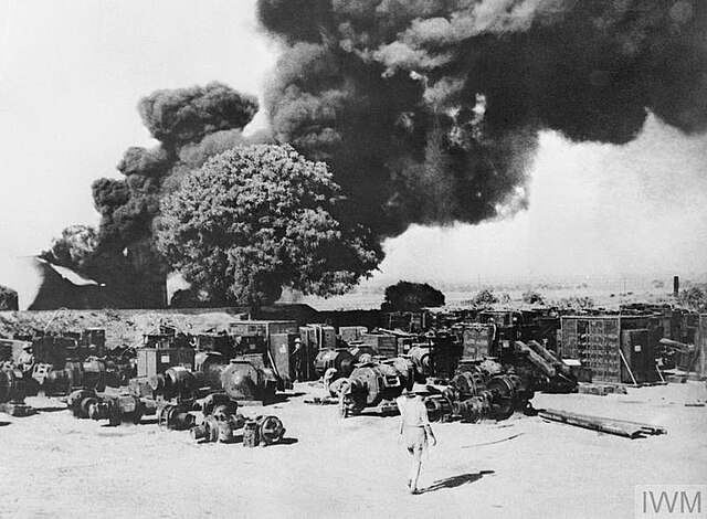 Electrical equipment and oil installations at Yenanguang being destroyed as part of the "scorched earth" policy, in the face of the Japanese advance