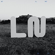 Rounded letters L and N in a grassy field; the album title is scattered across the cover in blue.