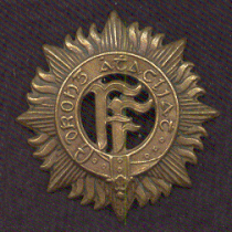 An original Volunteers brass badge dating from circa 1914. The inscription reads Drong Ata Cliat (Drong Atha Cliath in modern orthography), Irish for 'Dublin Brigade', a variant name for the Dublin Volunteer Brigade. Feb dubbde brass.gif