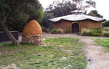 Straw bale hut and pizza oven constructed by HOL students HOL hut oven.jpg