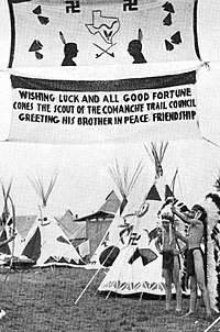 Comanche Trail Council Indian Camp at the National Scout jamboree in Washington, D.C., July 1937. The counterclockwise swastika emblems used for decoration still hold ancient meanings of luck and well-being, and not to be confused with clockwise Nazis symbolism. Comanche Trail Council Indian Camp 1937 National Scout Jamboree.jpg