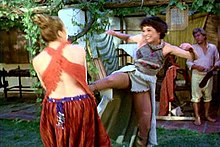 An example of what Time Magazine's movie critic Richard Corliss refers to as Hollywood's use of a blonde vs brunette polarity, dark haired Harper-Smythe fights her blonde nemesis, Marg, the Amazon leader. Janet Margolin vs Diana Muldaur Fight Scene.jpg