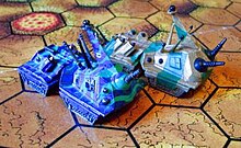 Ogre Mk.III and Mk.III-B miniatures, on the 'crater map' from the OGRE Deluxe set Ogreiii.jpg