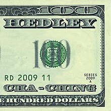Media imagen de un billete de 100 dólares que muestra el nombre de la banda y el título de la canción.