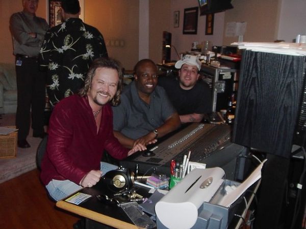 Bradford in a recording studio with Travis Tritt and Uncle Kracker