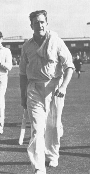 Jim Laker leaves the field after taking 19 for 90 at Old Trafford in 1956.