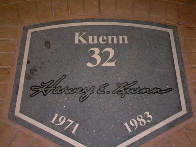 A dark granite plaque inscribed with white text reading, "Kuenn, 32, 1971, 1983" along with the facsimile signature of Harvey Kuenn