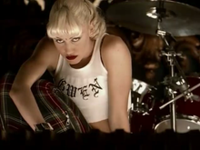Stefani drew comparisons to Madonna for designing her own wardrobe in the "Spiderwebs" video. No Doubt "Spiderwebs" music video.png