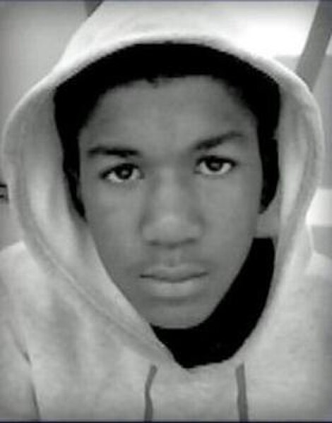 An undated personal photo of Trayvon Martin wearing a hoodie was displayed by protesters and sold by merchants on hoodies, T-shirts, and keychains, pr