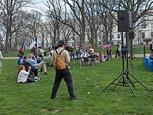 Jim Robinson, waving a U.S. flag at right, musters about two dozen other Freepers for the March for Justice II rally at the Upper Senate Park on the United States Capitol grounds on Thursday, April 7, 2005. MFJII 02.jpg