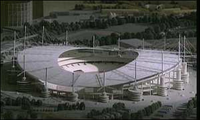 Model of 80,000-seat stadium used in 2000 Olympic Bid. The proposed stadium was a larger design, with more access ramps and masts.
