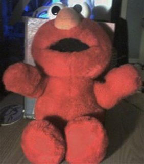 Tickle Me Elmo Muppet character childrens plush toy