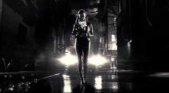 Becky (Alexis Bledel) walking down a street, an example of the film's neo-noir atmosphere