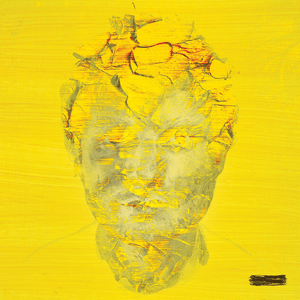 A digitally manipulated photograph of Ed Sheeran's face on a yellow field and covered with yellow dirt.