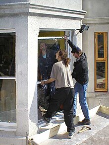 Volunteers fit new windows at the Sumac Centre in Nottingham, England, UK. Volunteers installing windows at the Sumac Centre.jpg