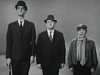 Cleese, Barker, and Corbett in the Class sketch broadcast in April 1966 FrostReportClassSketch.jpg