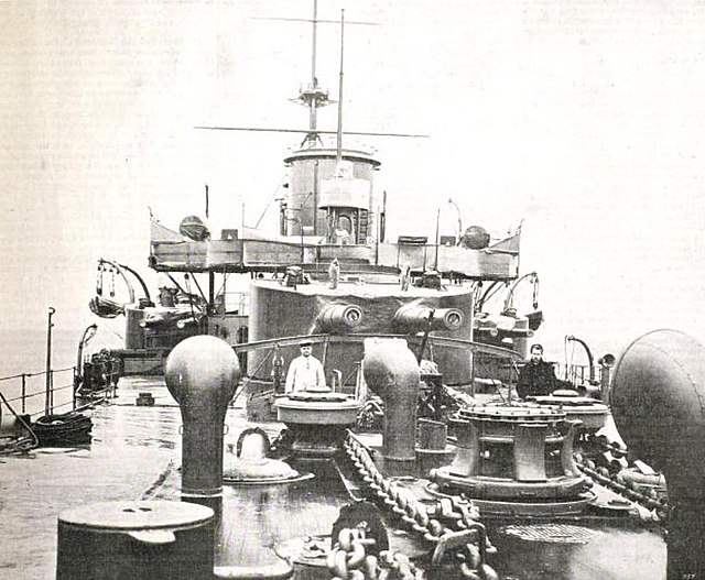 Rurik's forward main battery turret; two of her secondary turrets are visible to either side