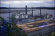 Northwestern on Kuskokwim River, offloading lumber at Sterling Landing, intended for use at Yankee Camp, ca. 1948. Northwestern on Kuskokwim River ca 1948.jpg