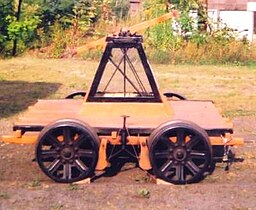 A handcar, in original condition (at the Shelburne Falls Trolley Museum). The foot brake operating mechanism may be seen between the wheels.