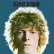 A headshot of a young man with shaggy hair, with the words "David Bowie" at the top