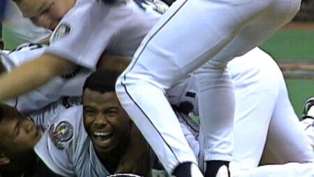 Ken Griffey Jr. (center) and the Seattle Mariners celebrate after he scored the winning run in Game 5 of the 1995 ALDS.